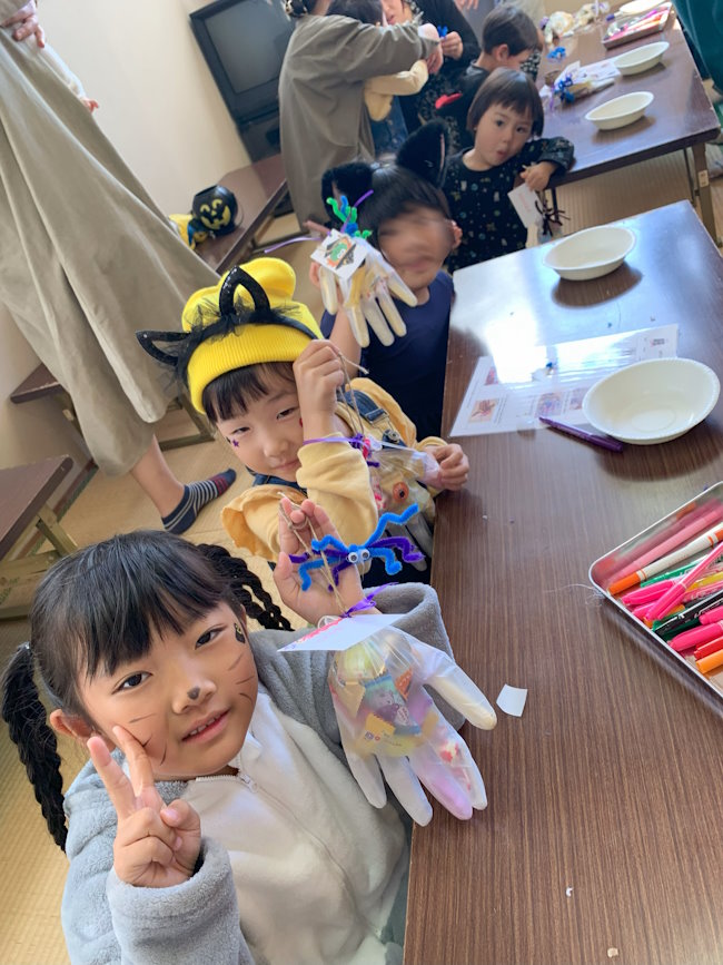 Students making Halloween crafts.