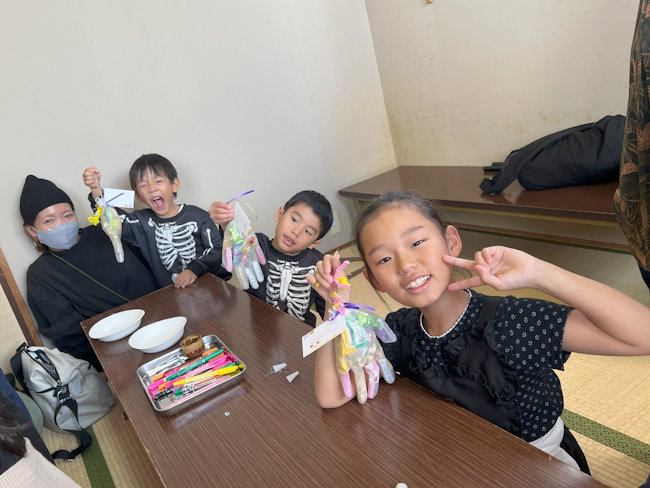 Students making Halloween crafts.